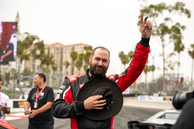 Taylor standing next to his drift racecar